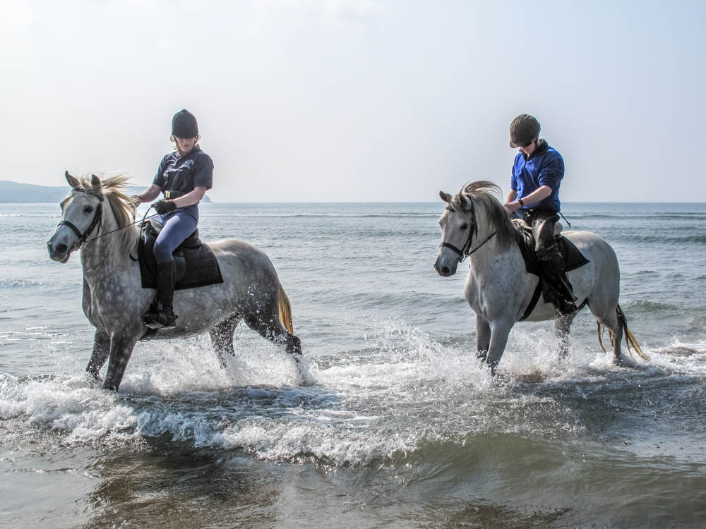 Rainbow and Socrates rehearsing in the surf.